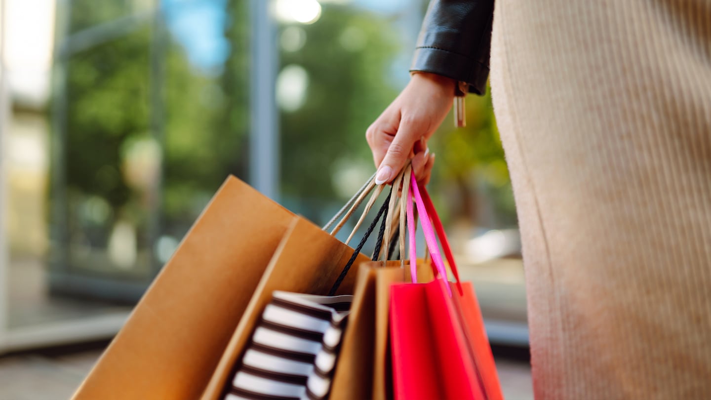 A woman holding shopping bags.