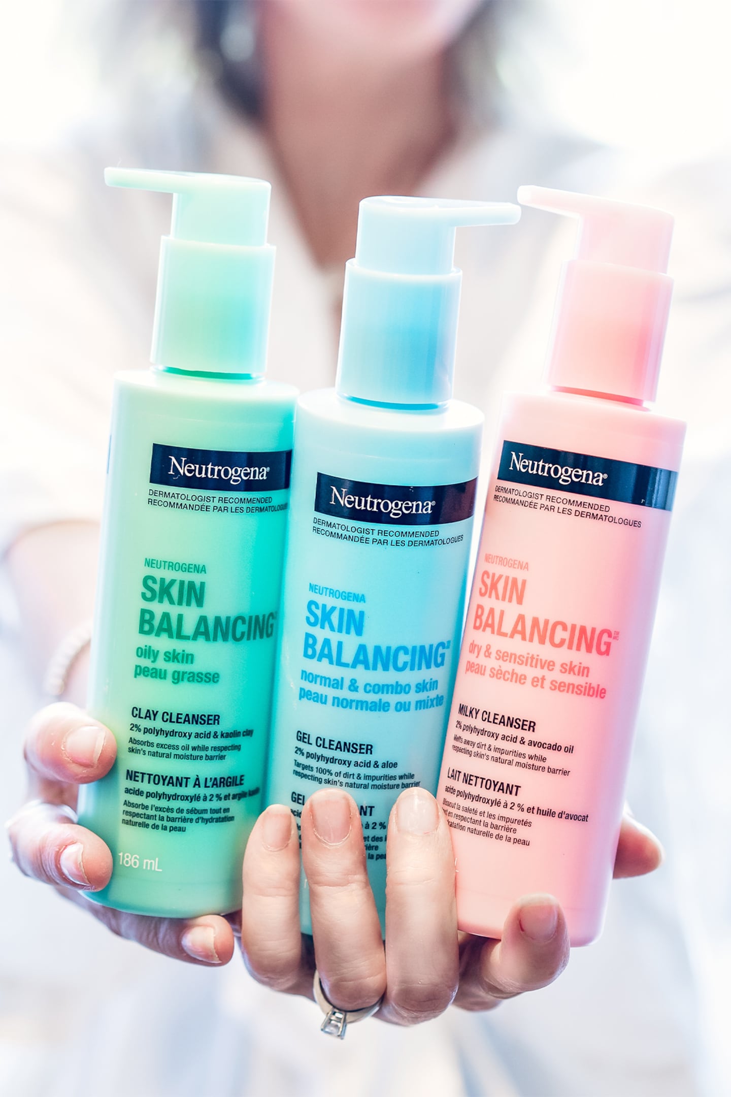 A model holding Neutrogena products