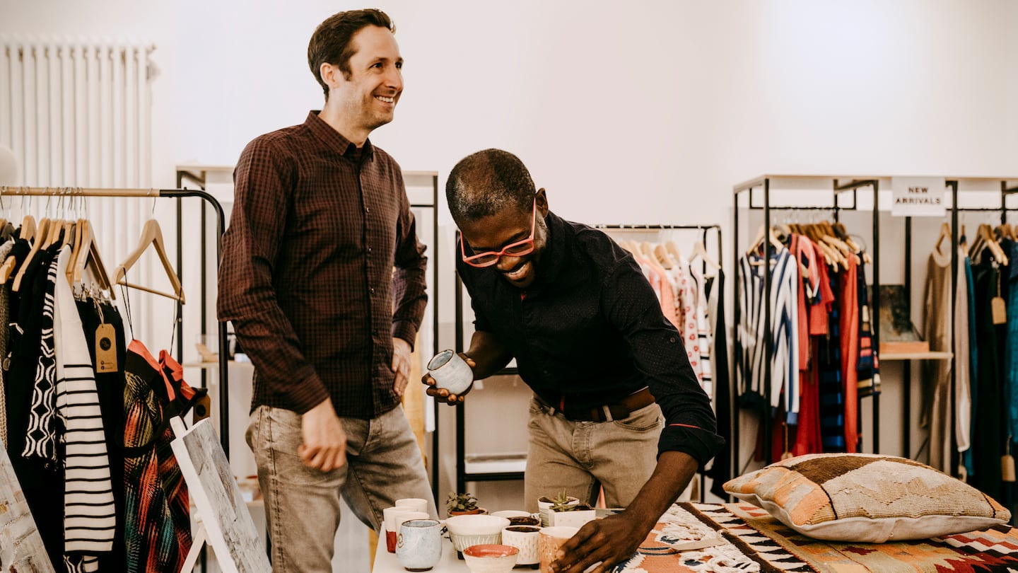 Two employees working in a fashion retail store