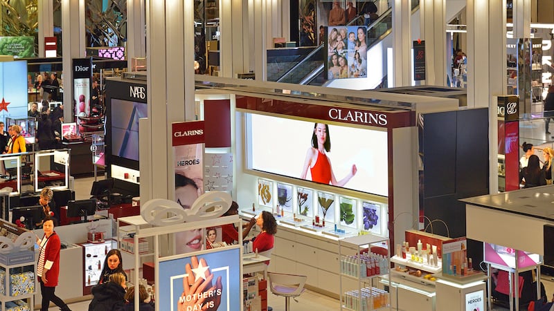 Inside Macy's store, beauty counters.